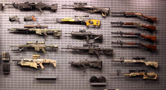 Display guns on wall